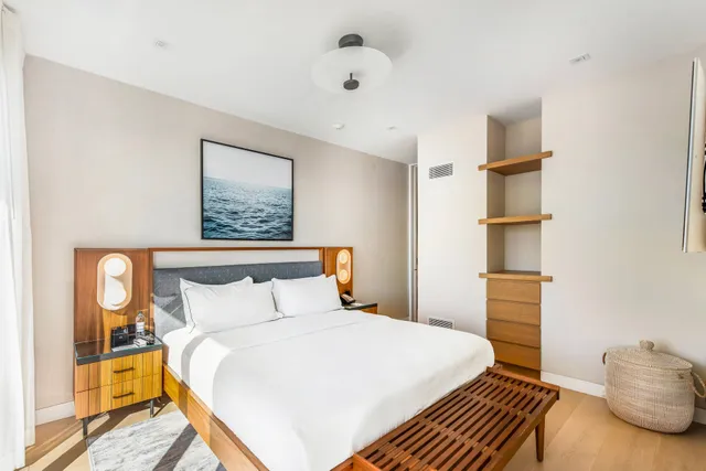 a bedroom with a bed and a cabinets