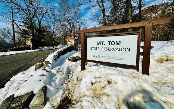 a sign on the side of the road