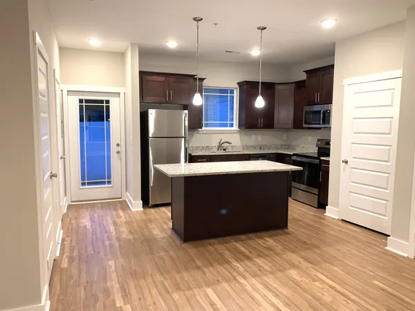 a kitchen with a sink and an oven