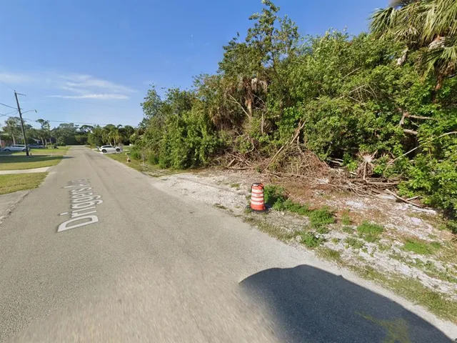 a view of a terrace with a bench and trees