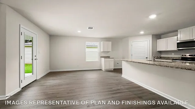 a view of a kitchen with a sink and a window