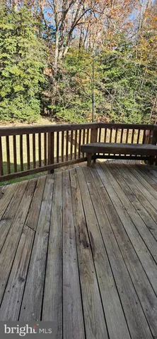 a view of wooden balcony with a swing