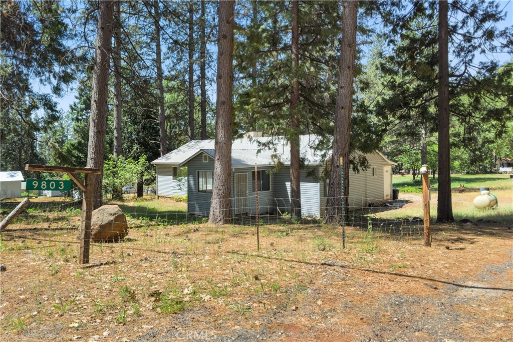 9803 Cohasset Road Chico, CA 95973 - Photo 22 of 22 a backyard of a house with parked cars
