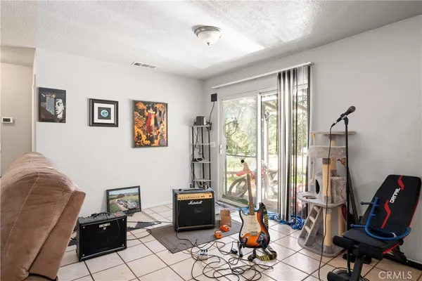 a living room with furniture a rug and a large window