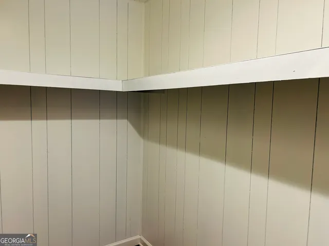 a bathroom with a sink vanity and a mirror