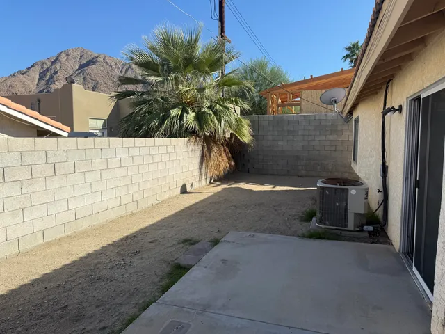 a view of a back yard of the house