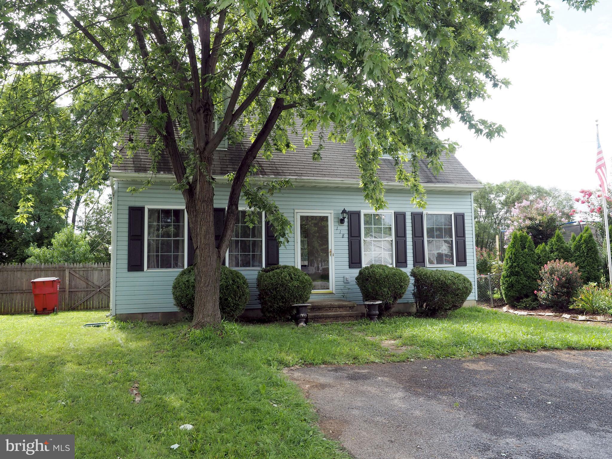 118 Ranson Estates Circle Ranson, WV 25438 - Photo 1 of 15 a front view of a house with garden