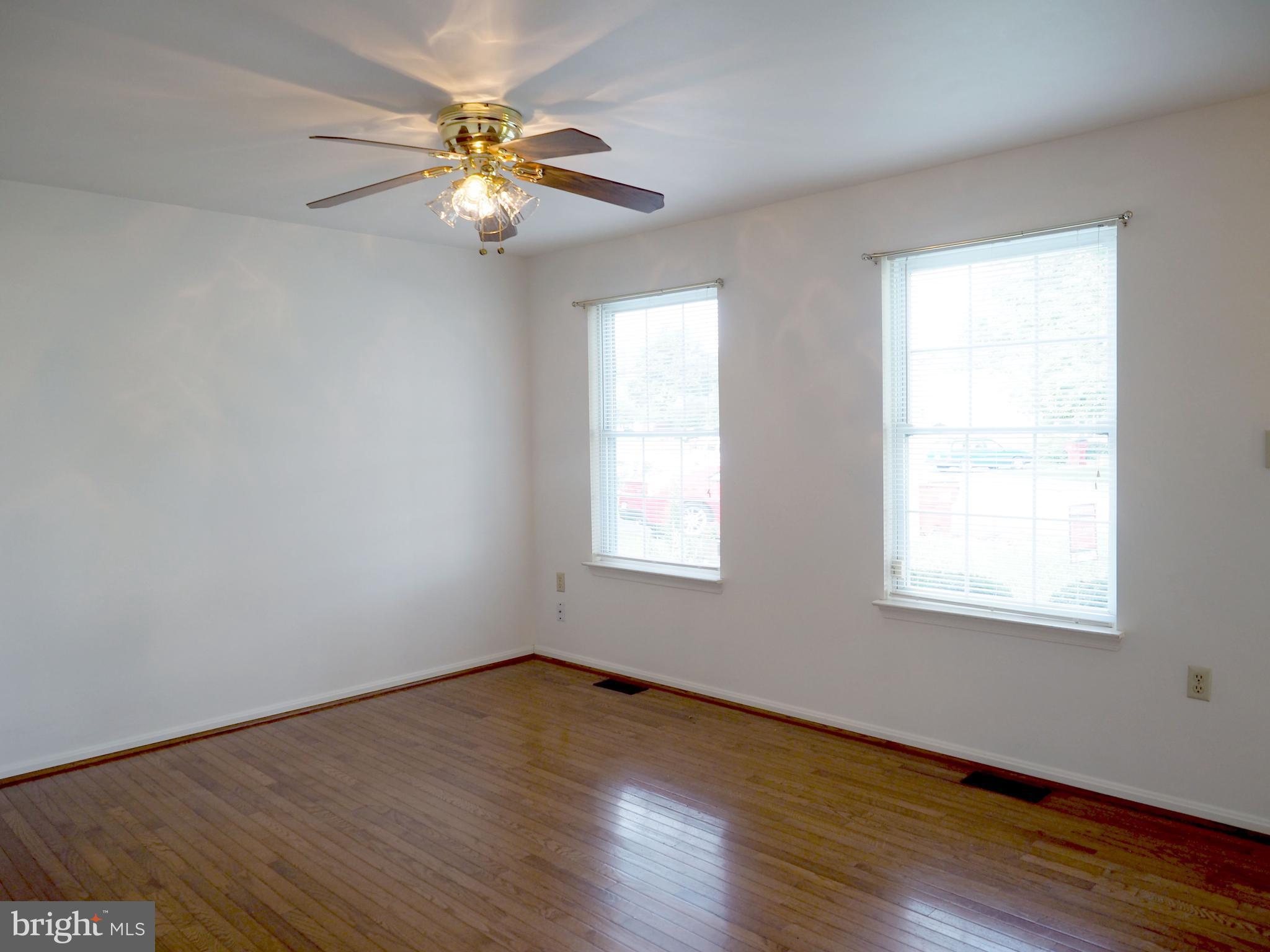 118 Ranson Estates Circle Ranson, WV 25438 - Photo 2 of 15 a view of an empty room with wooden floor and a window