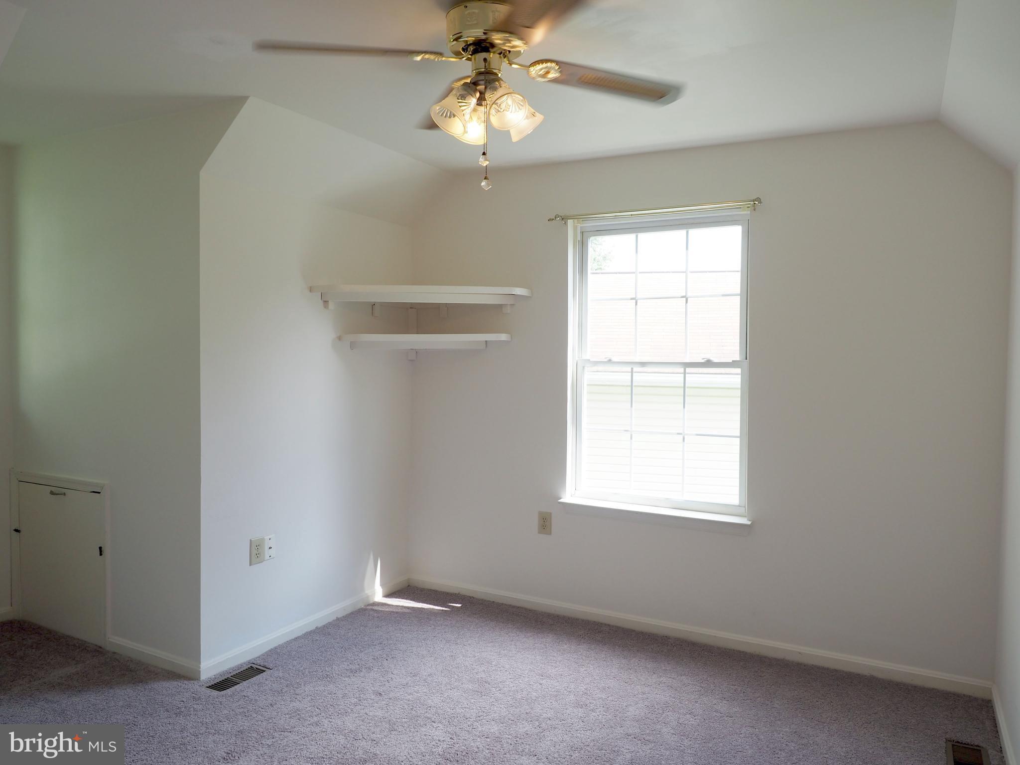 118 Ranson Estates Circle Ranson, WV 25438 - Photo 11 of 15 an empty room with a window and a fan