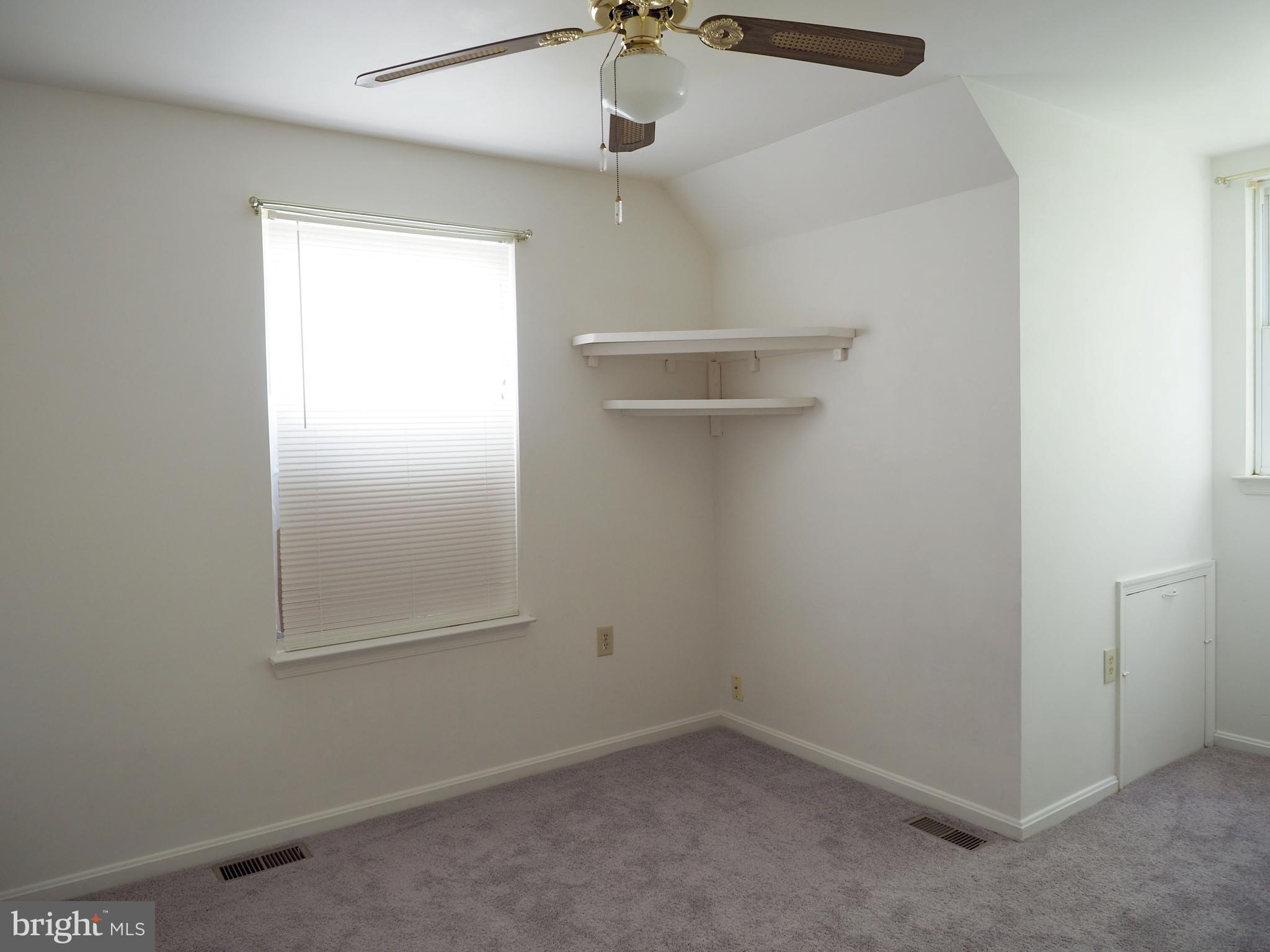 118 Ranson Estates Circle Ranson, WV 25438 - Photo 13 of 15 an empty room with a window and a ceiling fan