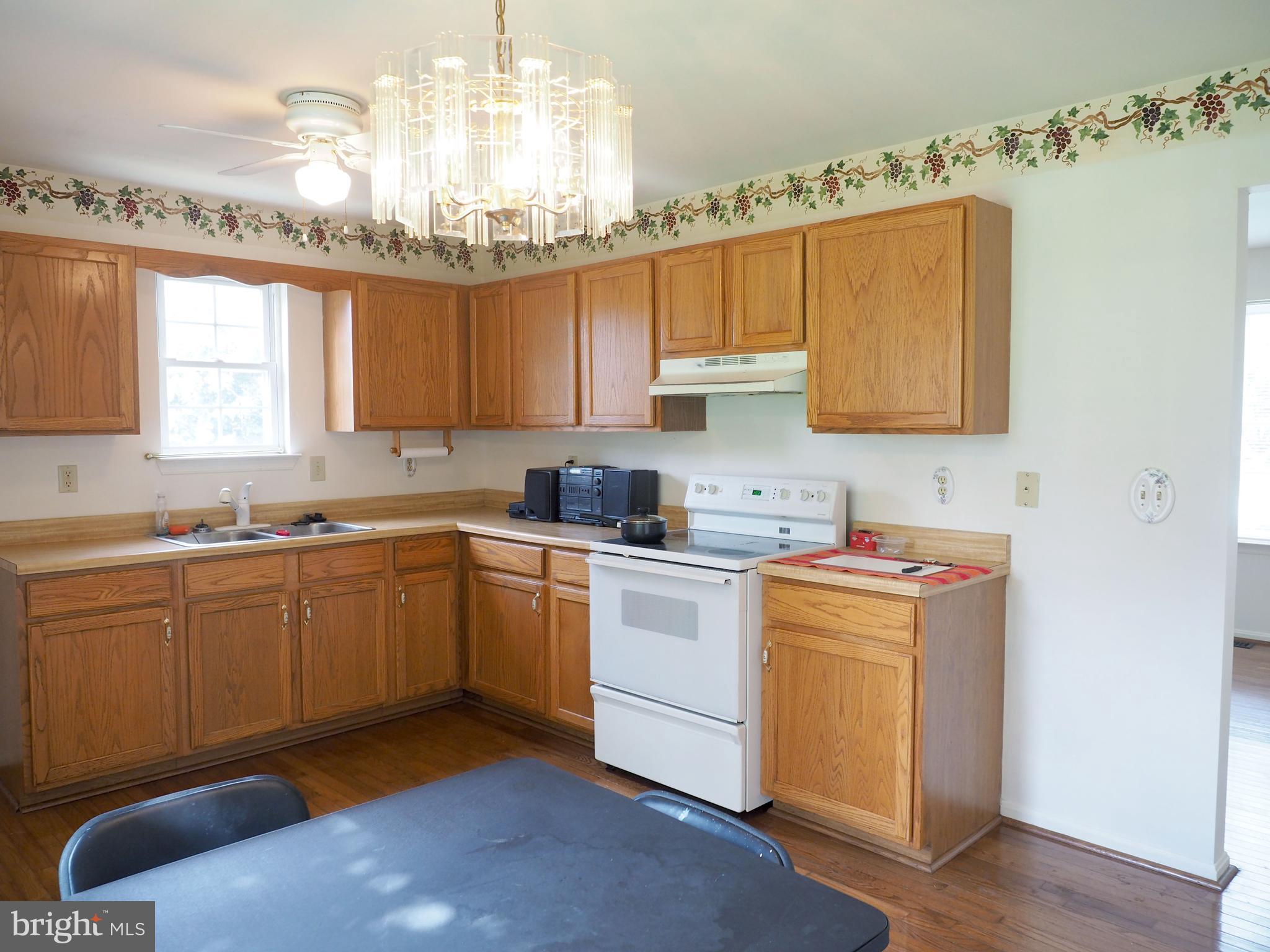118 Ranson Estates Circle Ranson, WV 25438 - Photo 5 of 15 a kitchen with a sink cabinets and window