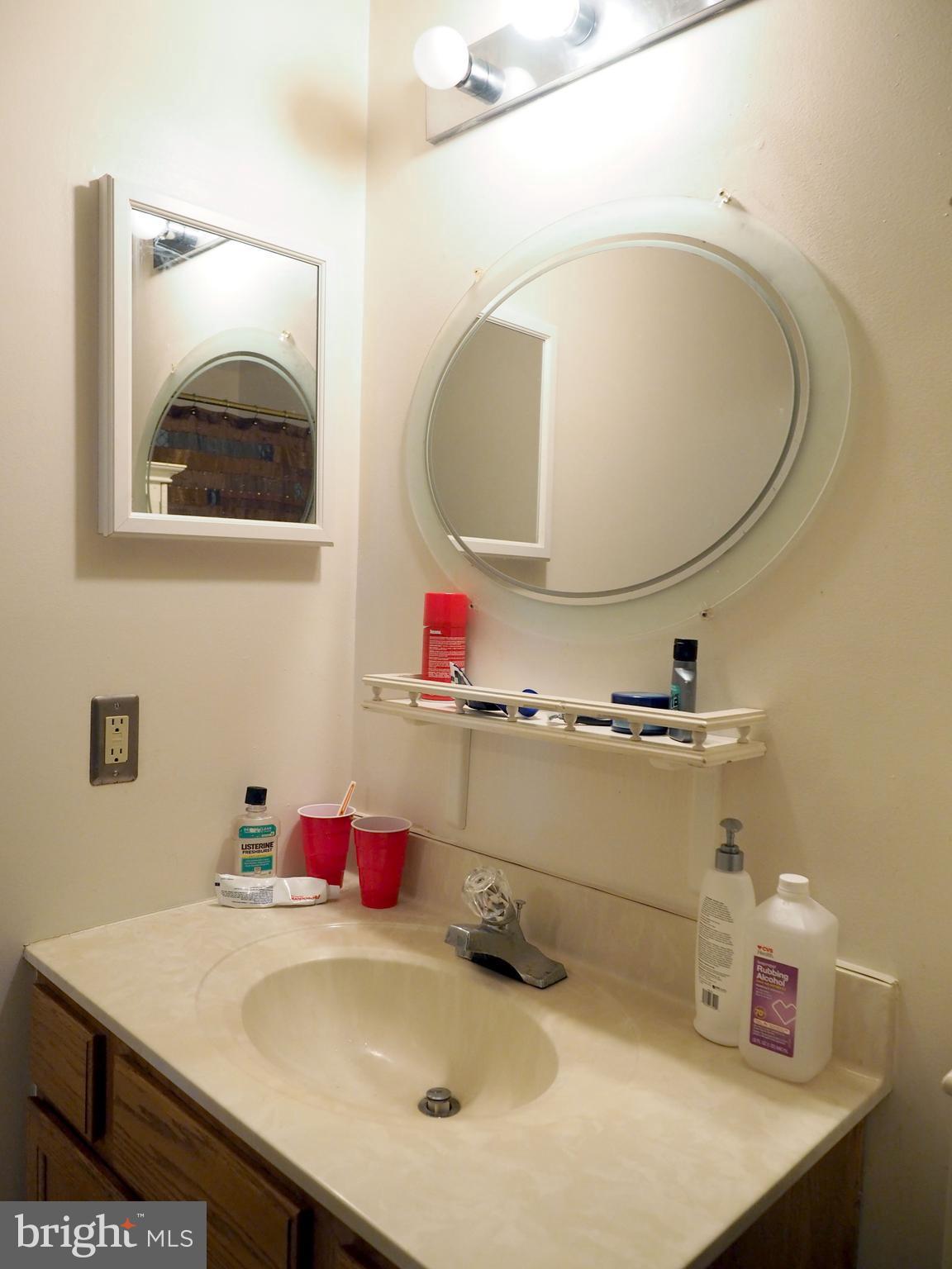 118 Ranson Estates Circle Ranson, WV 25438 - Photo 9 of 15 a bathroom with a sink and a mirror