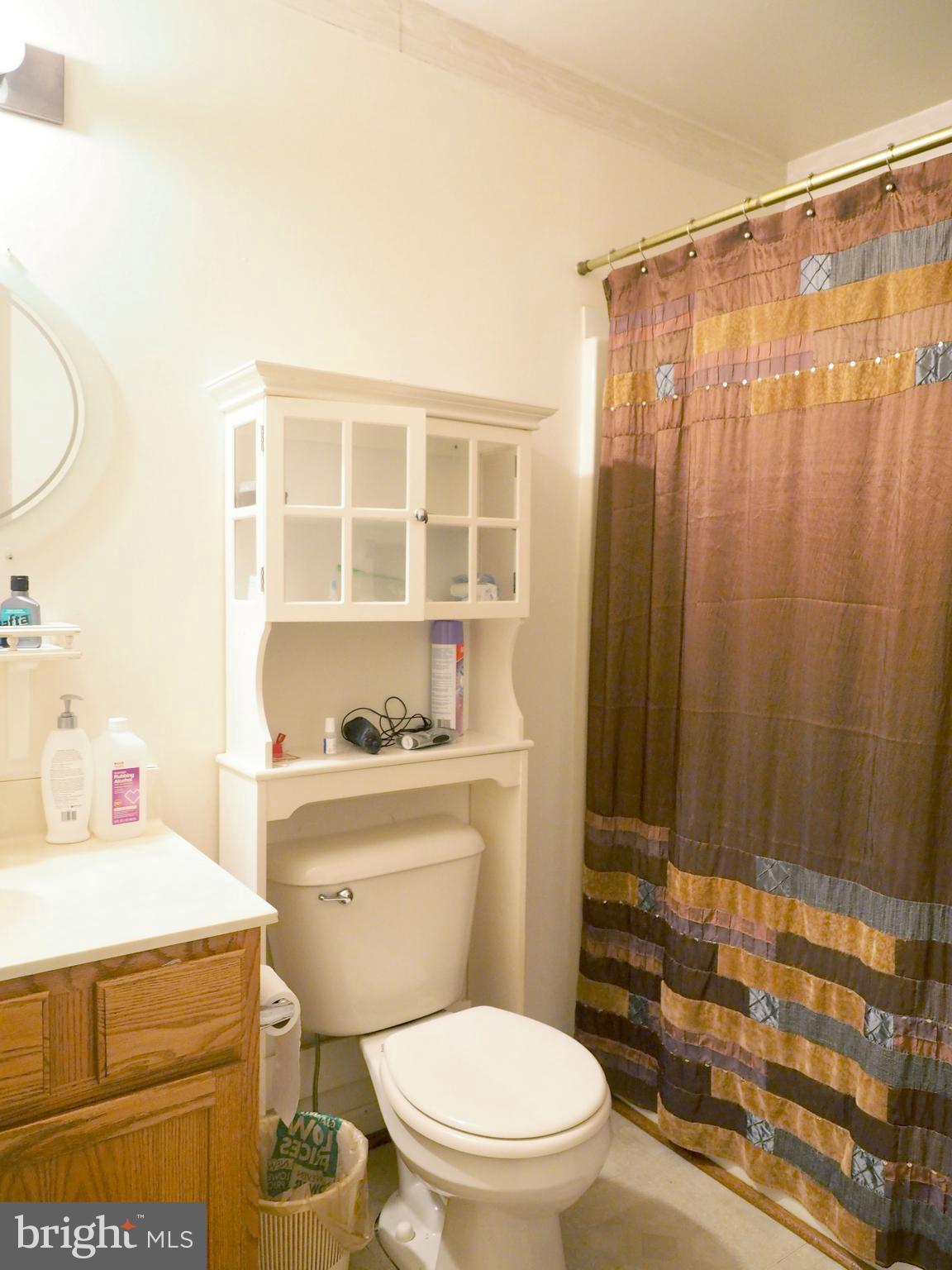 118 Ranson Estates Circle Ranson, WV 25438 - Photo 10 of 15 a bathroom with a toilet a sink and a shower