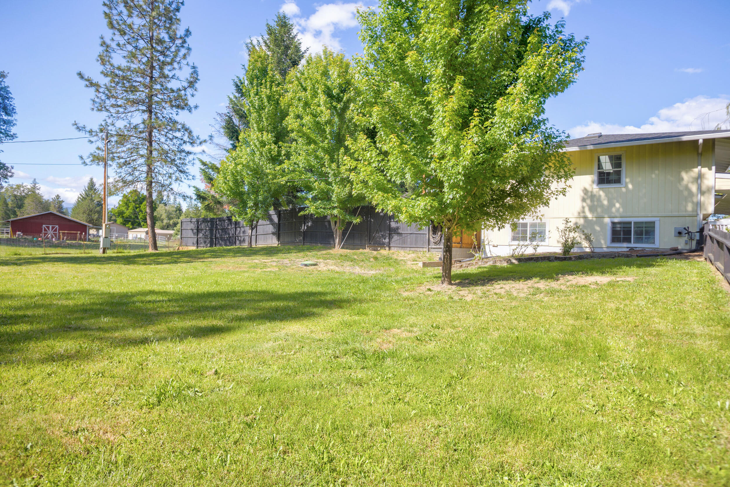 255 Queens Branch Road Rogue River, OR 97537 - Photo 33 of 60 a view of a yard with a fountain