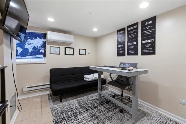 a living room with furniture and a rug