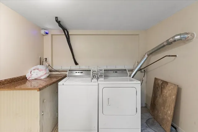 a view of a storage & utility room with a sink