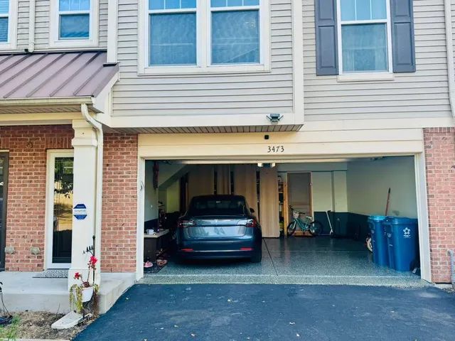 a car parked in front of a house