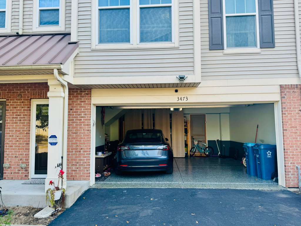 a car parked in front of a house