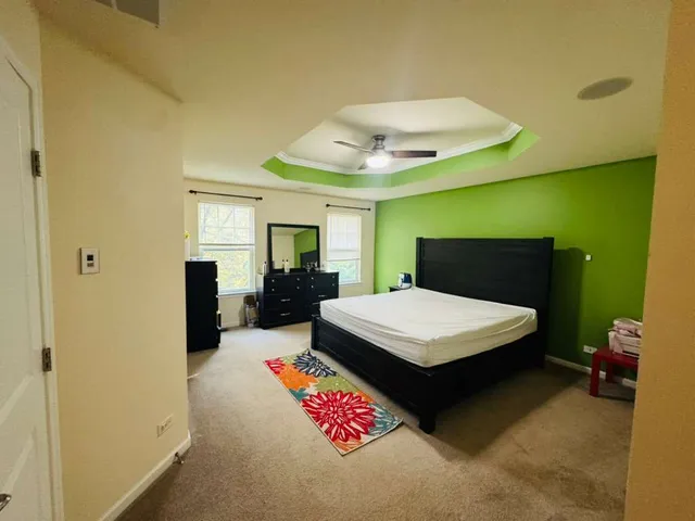 a bedroom with a bed and a table