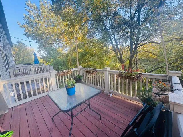 a view of a deck with wooden floor and fence