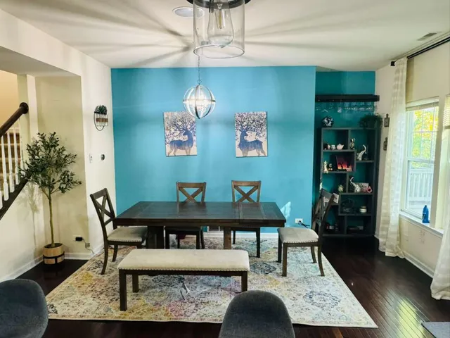 a view of a workspace with furniture and window