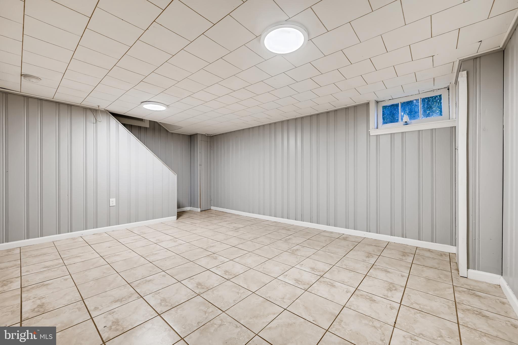 4029 Grantley Road Baltimore, MD 21215 - Photo 9 of 16 LARGE FINISHED BASEMENT WITH TILE FLOORING.