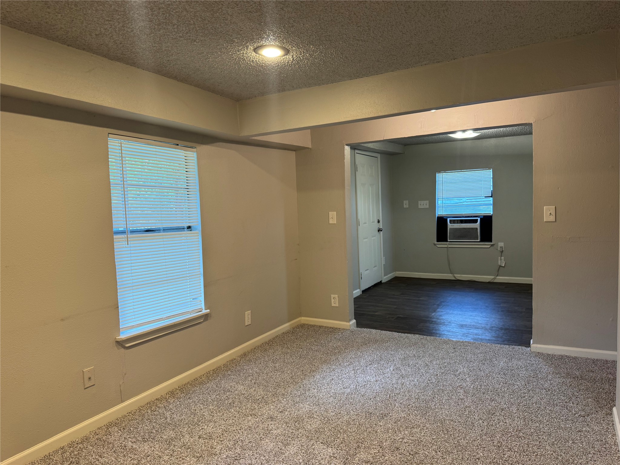 5007 Heflin Lane Austin, TX 78721 - Photo 4 of 25 A well-lit interior offers versatile living space with varied flooring.