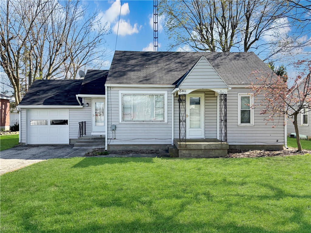 8411 Pitsburg-Laura Road Arcanum, OH 45304 - Photo 1 of 16 This charming home offers classic appeal with a welcoming facade and lush green lawn.
