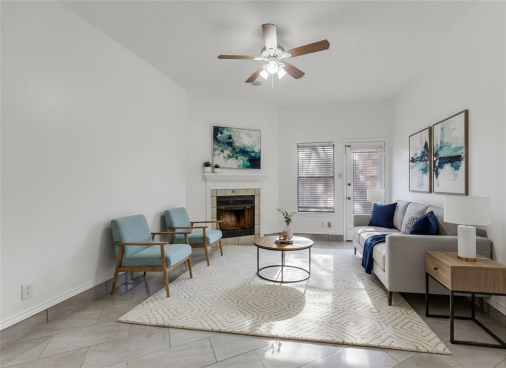 7340 Skillman Street, Unit 605 Dallas, TX 75231 - Photo 14 of 25 a living room with furniture and a fireplace