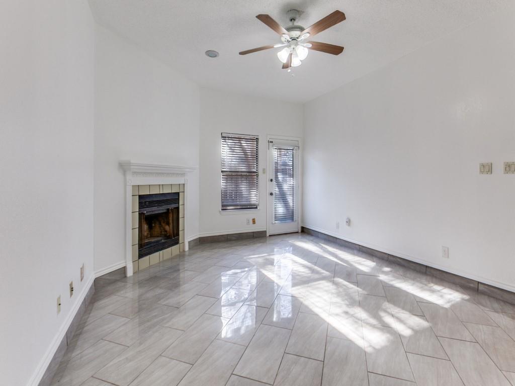 7340 Skillman Street, Unit 605 Dallas, TX 75231 - Photo 15 of 25 a view of empty room with a fireplace