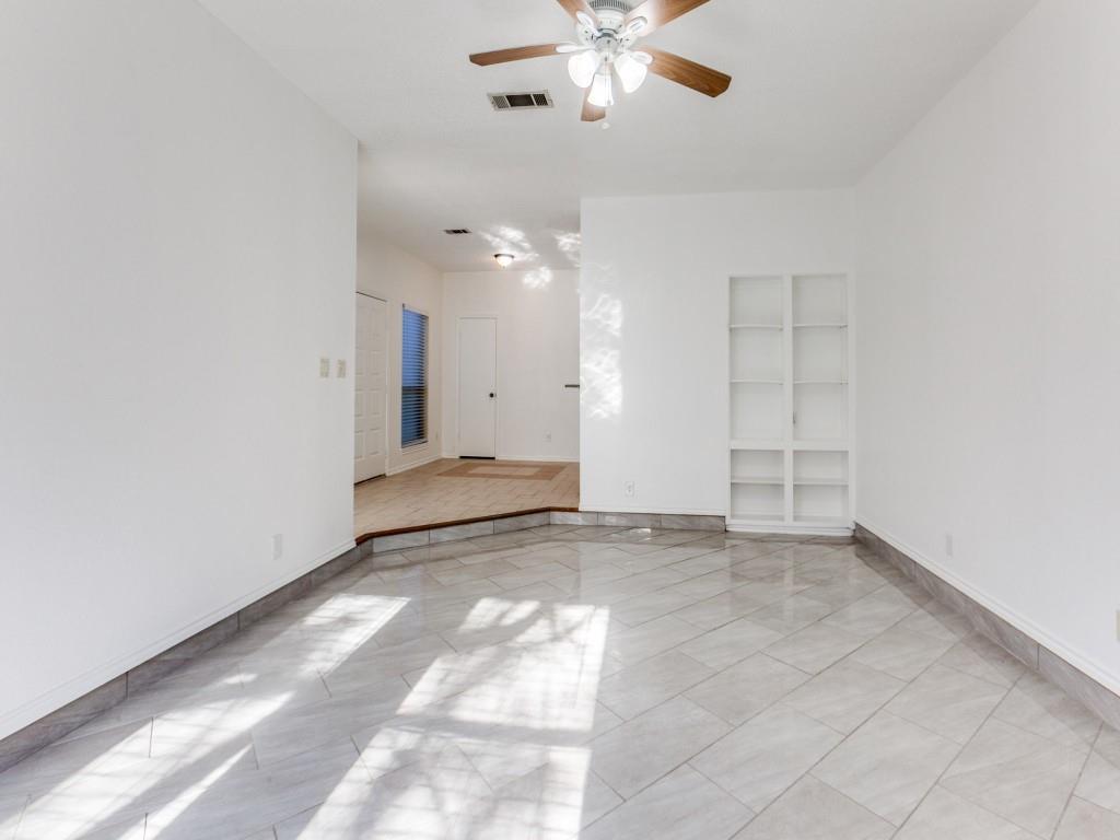 7340 Skillman Street, Unit 605 Dallas, TX 75231 - Photo 17 of 25 an empty room with fan and windows