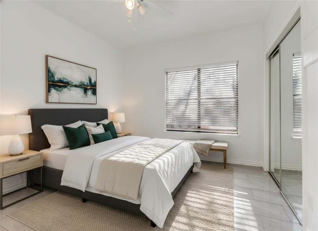 7340 Skillman Street, Unit 605 Dallas, TX 75231 - Photo 19 of 25 a bedroom with a large bed and a window