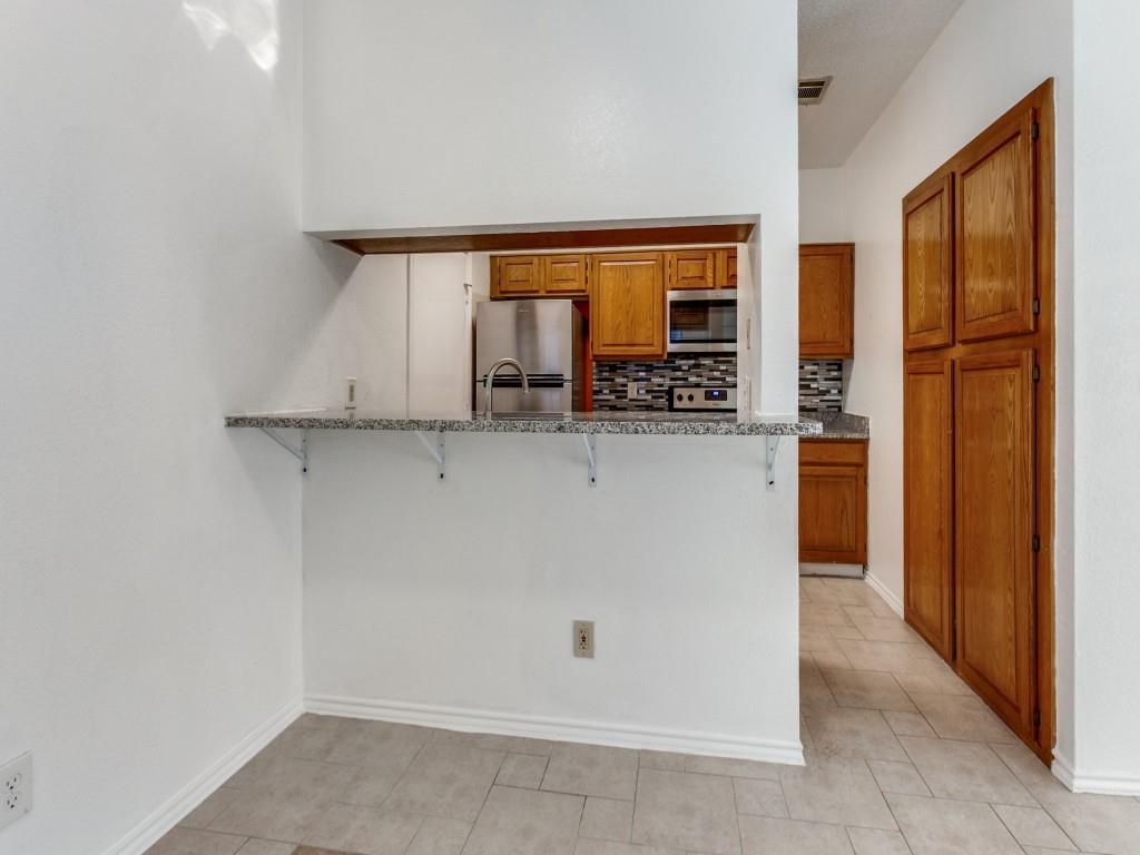 7340 Skillman Street, Unit 605 Dallas, TX 75231 - Photo 6 of 25 a view of a kitchen with an entryway