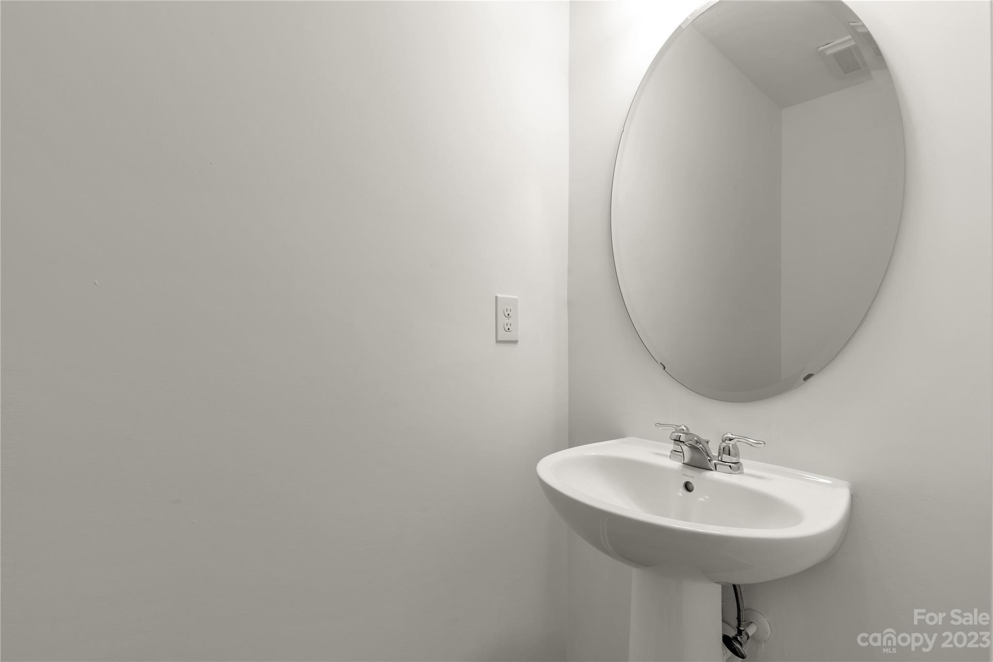 4081 Taxahaw Road Lancaster, SC 29720 - Photo 27 of 36 a bathroom with a sink a mirror and a toilet