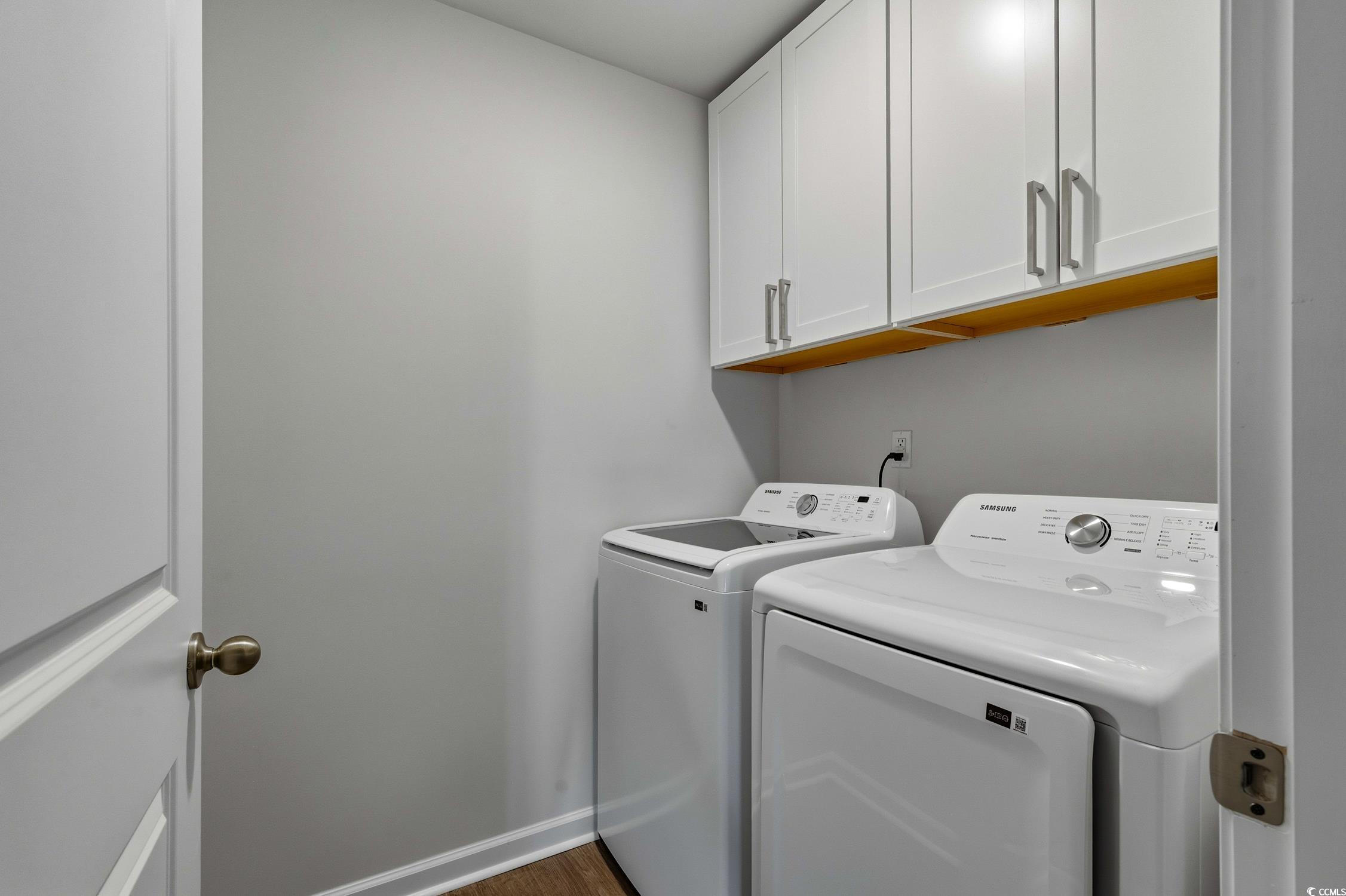 256 Country Grove Way Galivants Ferry, SC 29544 - Photo 16 of 22 Laundry area featuring cabinet space, separate washer and dryer, and dark wood-style floors