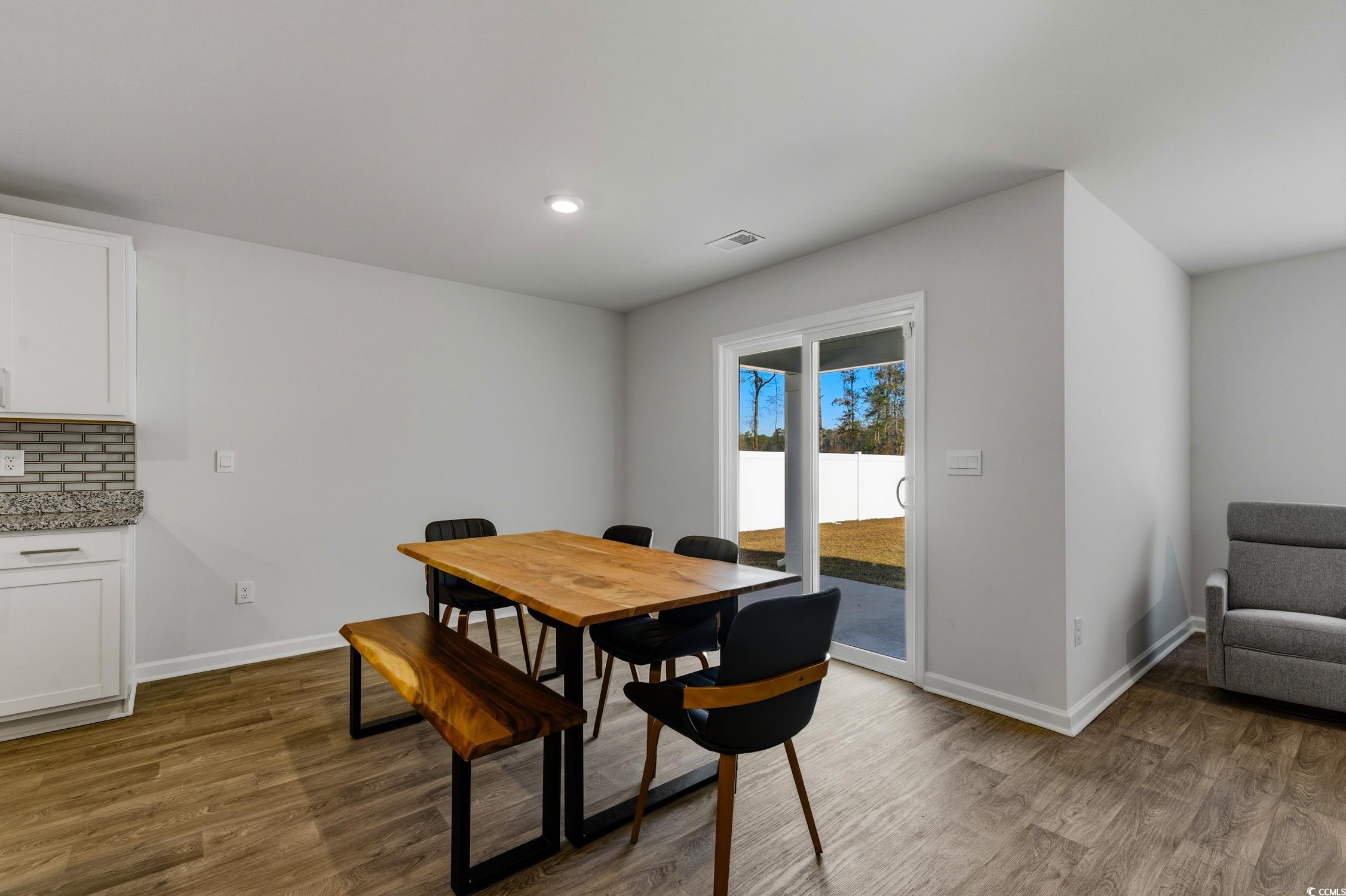 256 Country Grove Way Galivants Ferry, SC 29544 - Photo 5 of 22 Dining space with dark wood-style floors and recessed lighting