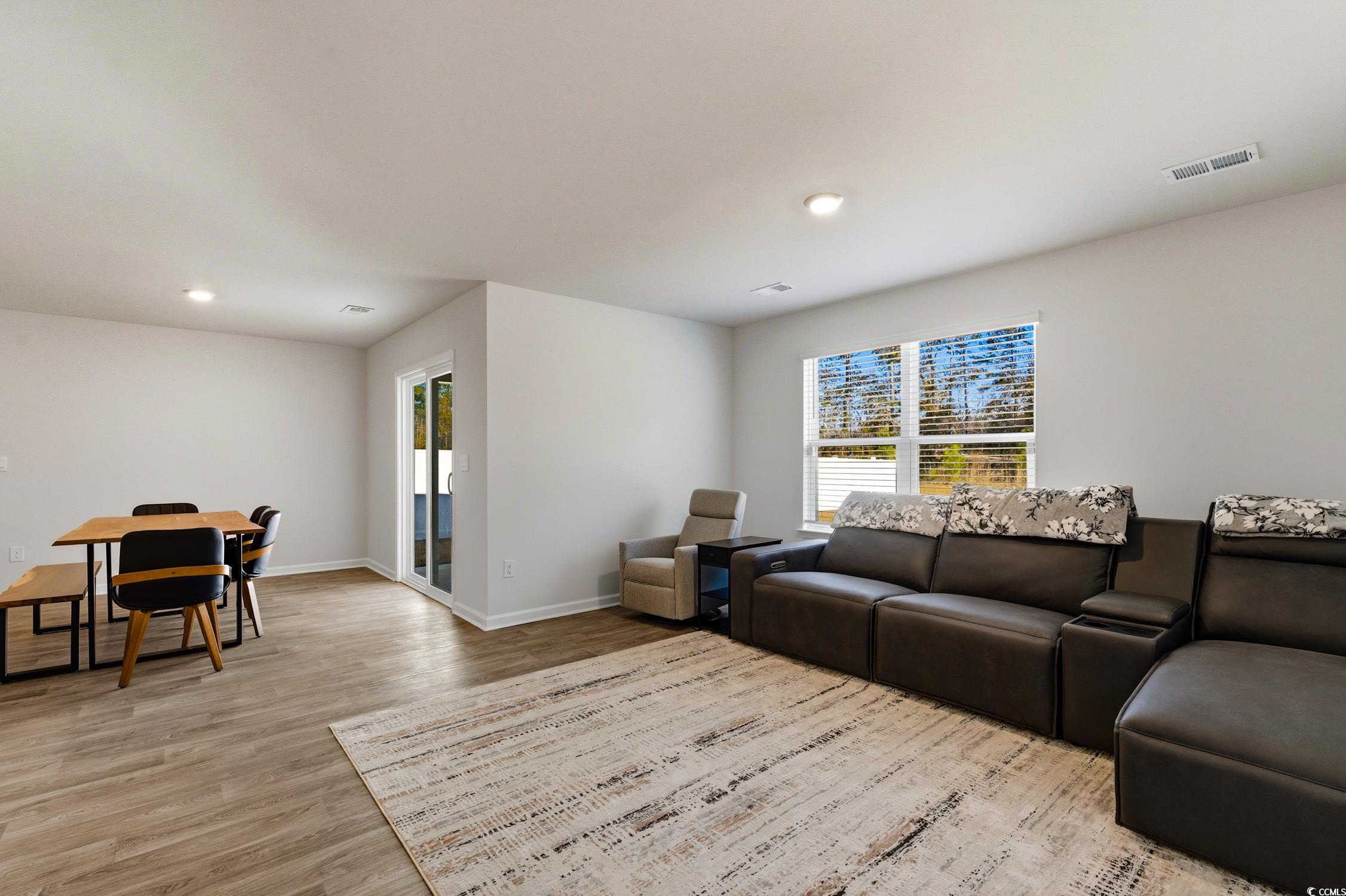 256 Country Grove Way Galivants Ferry, SC 29544 - Photo 8 of 22 Living room with healthy amount of natural light, recessed lighting, and light wood-type flooring