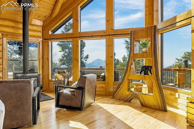 a bedroom with furniture and a large window