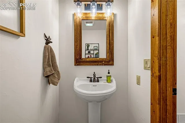 a view of a house with wooden fence