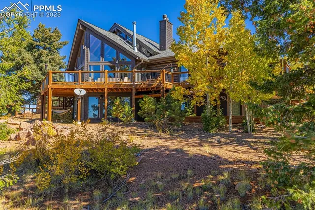 a view of balcony with wooden floor and fence