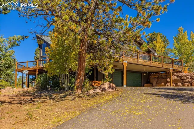 a living room with furniture a rug and a chandelier