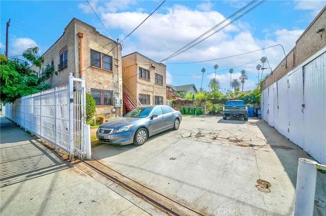a view of a patio with couches and potted plants