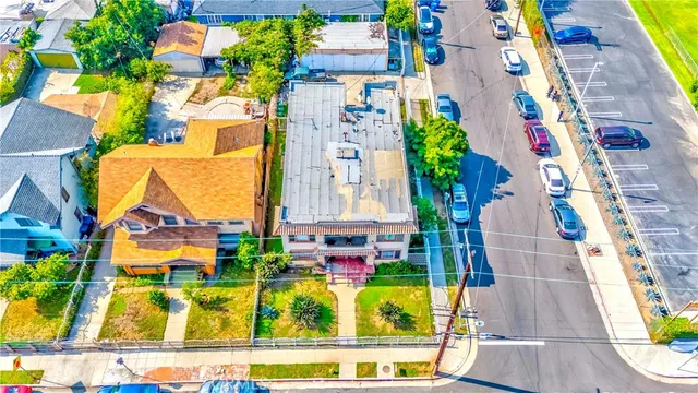 a front view of a building with outdoor seating