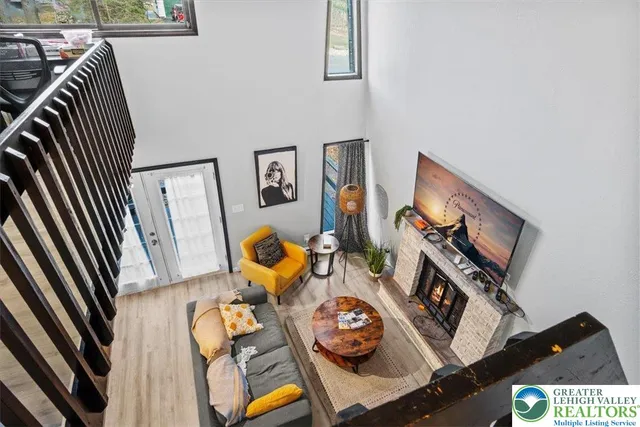 a view of living room with furniture and wooden floor