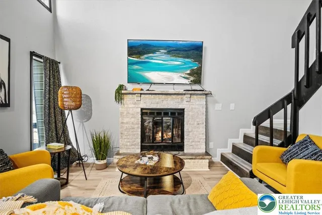 a living room with furniture and a fireplace