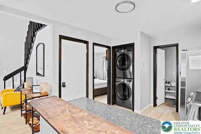 a en suite bathroom with a granite countertop sink and a mirror