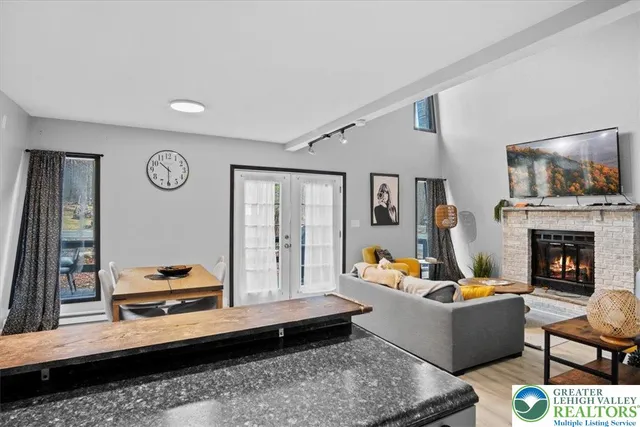 a living room with furniture and a fireplace