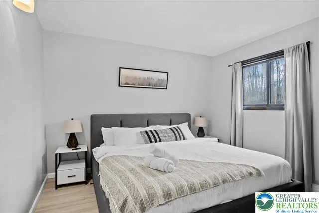 a bedroom with a bed and balcony