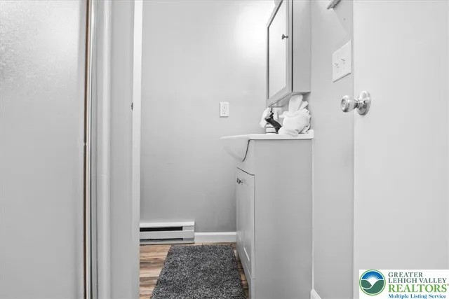 a bathroom with a sink and mirror