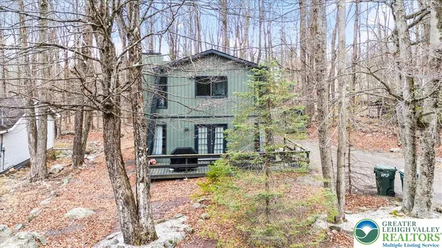 a front view of a house with yard